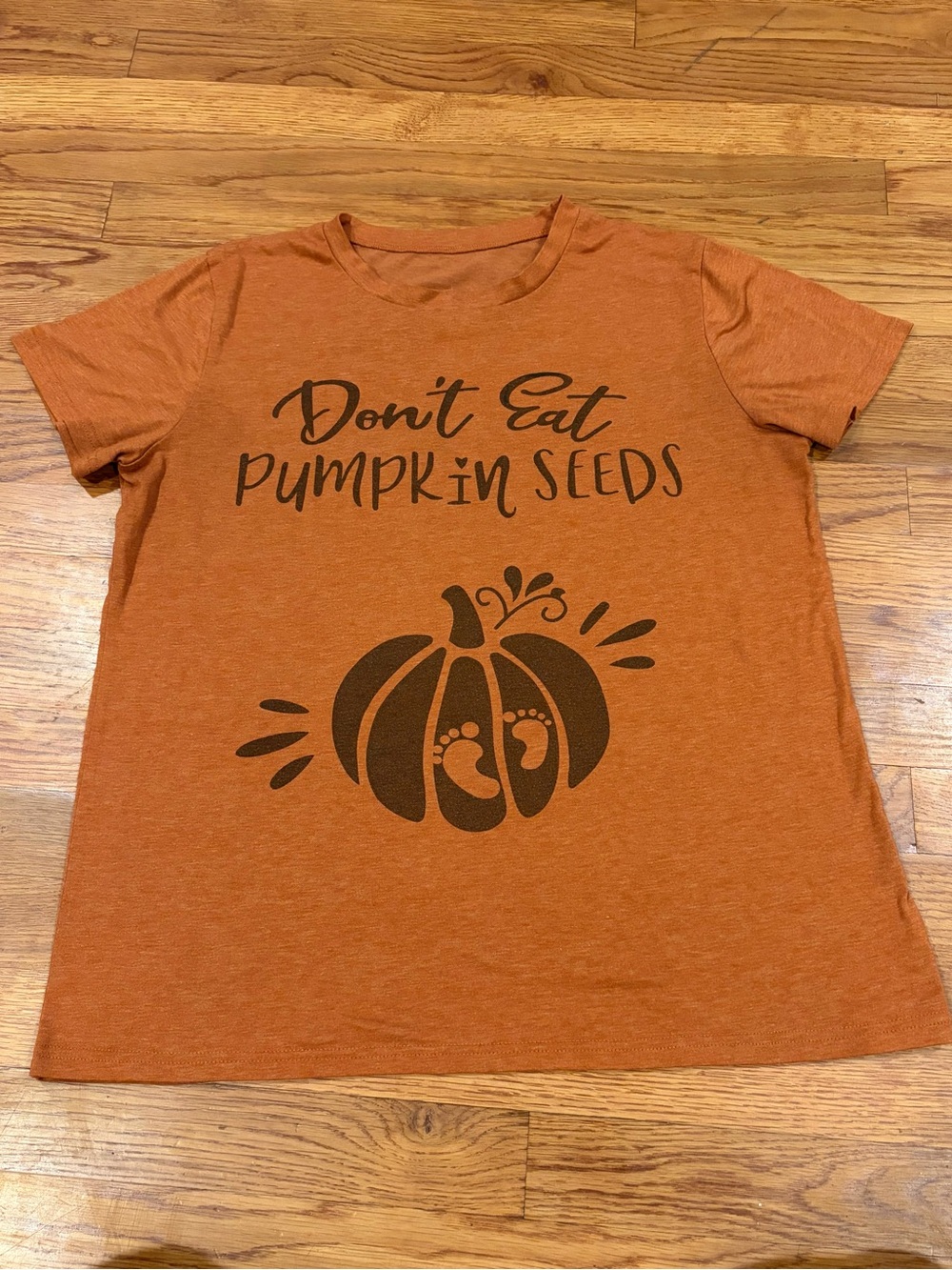 Women’s Large Pregnancy Orange Shirt “Don’t Eat Pumpkin Seeds.”